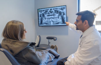 Dr. Chokshi with his patient. Dental visit.