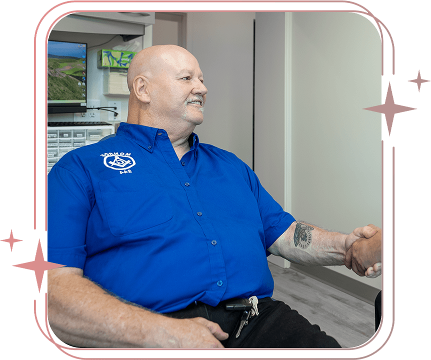 man with blue shirt in dental chair