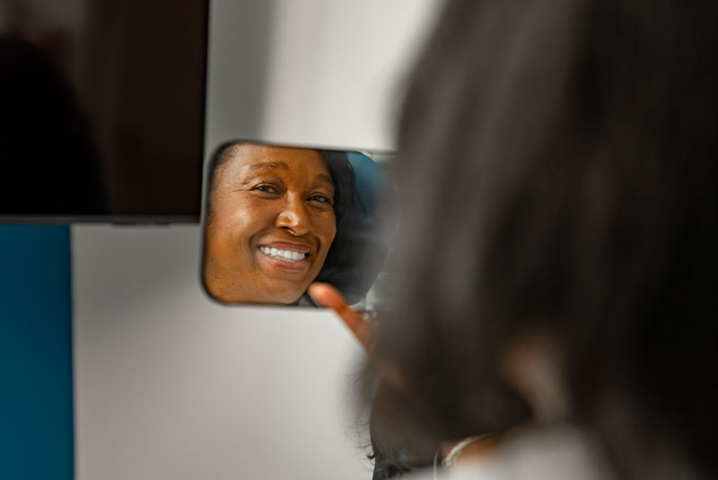 lady with smile reveal mirror